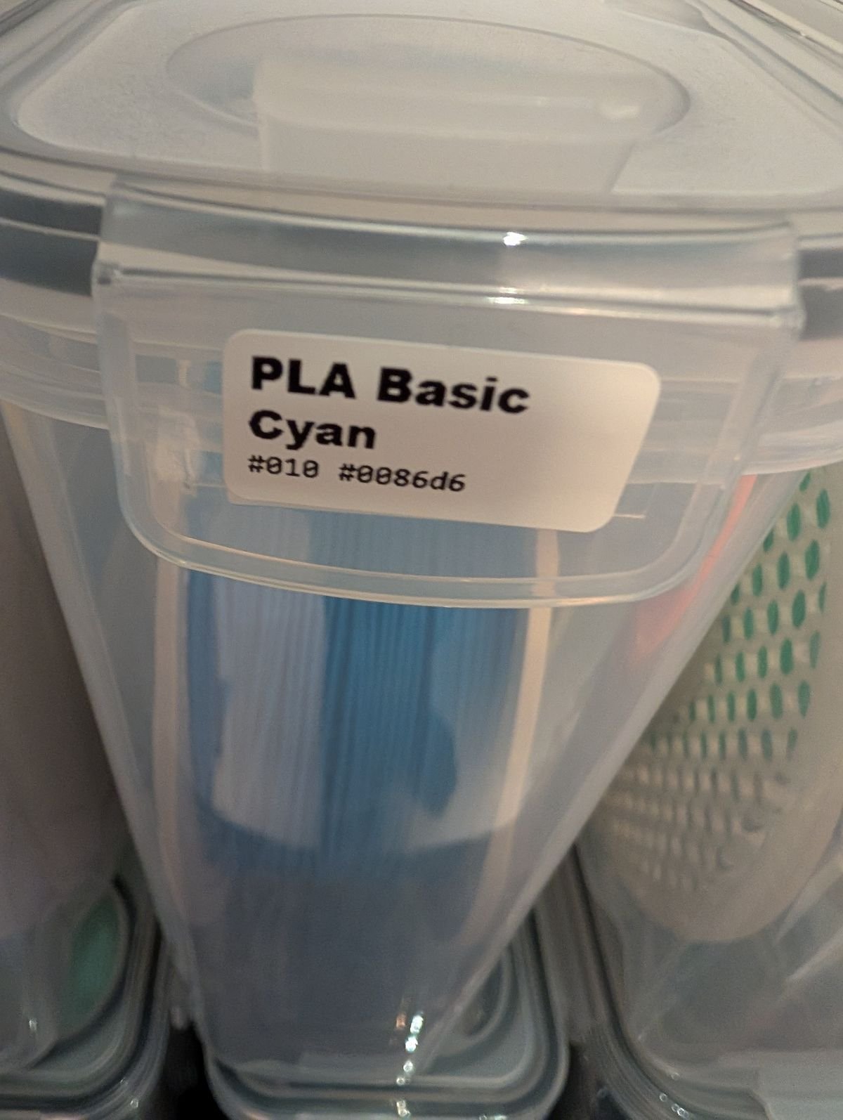Close-up of a printed label on a PLA Basic Cyan spool