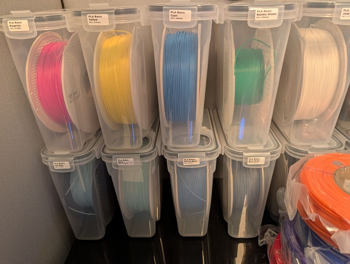 All filament spools labeled and organized in containers